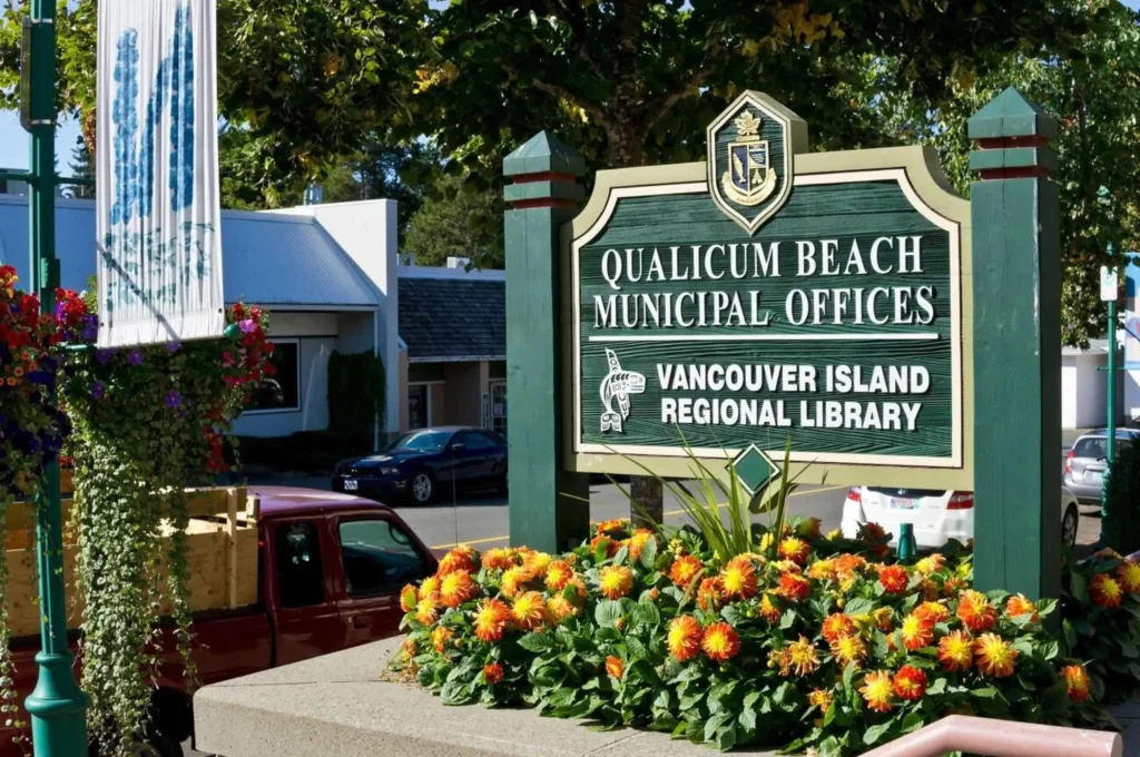 Sign for municipal buildings in downtown Qualicum Beach, British Columbia, Canada