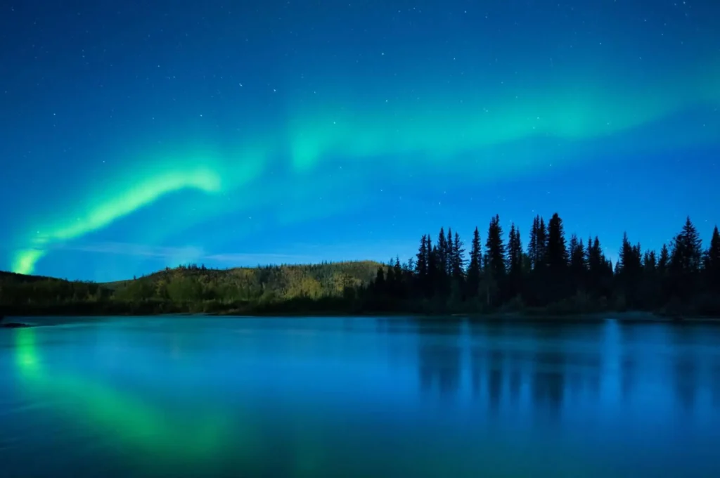 The Aurora Borealis (Northern Lights) over the Klondike River, Yukon Territories, Canada