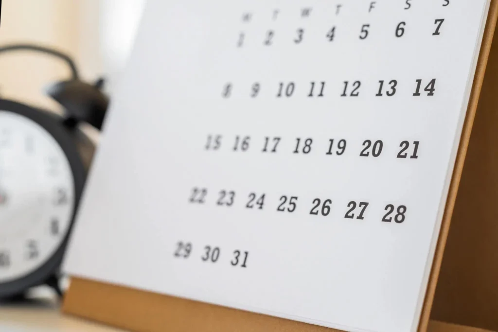 Calendar and clock on the table
