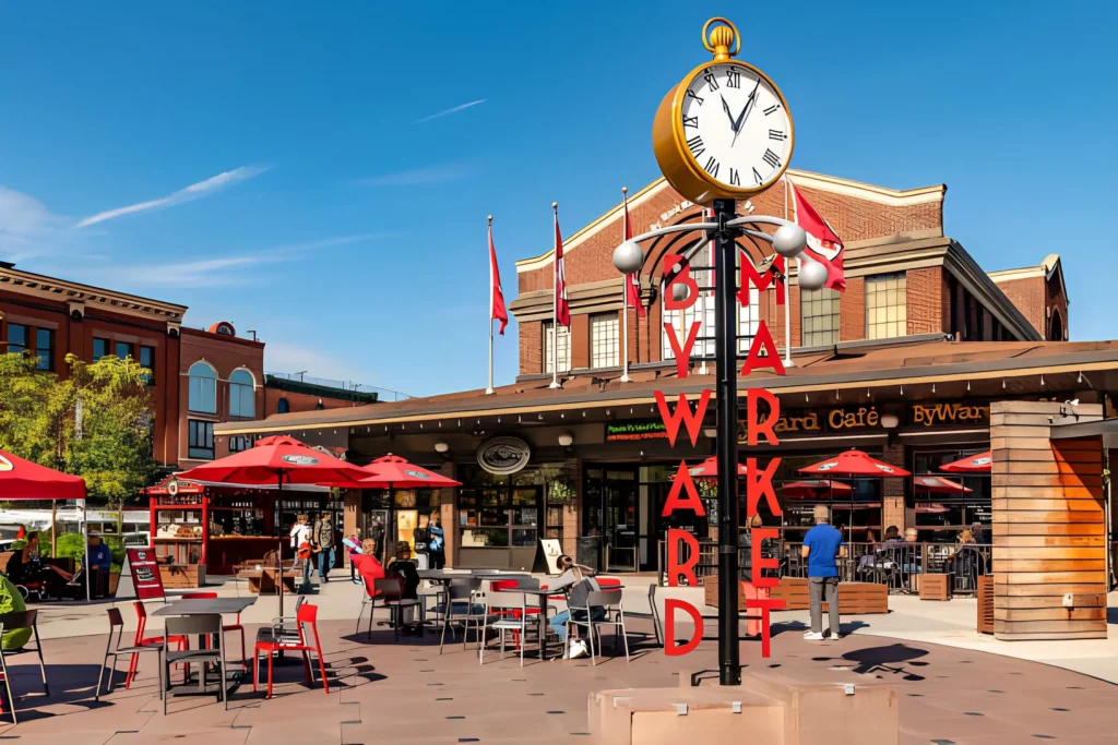 People sit outside the Byward Market in Ottawa.