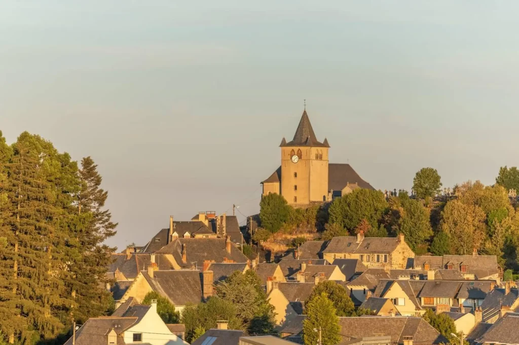 Small Saint-Matthieu church on hill of village of Laguiole. Aubrac, France.