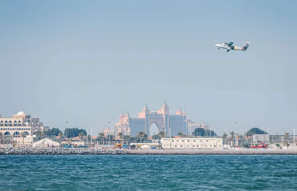 a plane is flying at Atlantis The Palm, Dubai